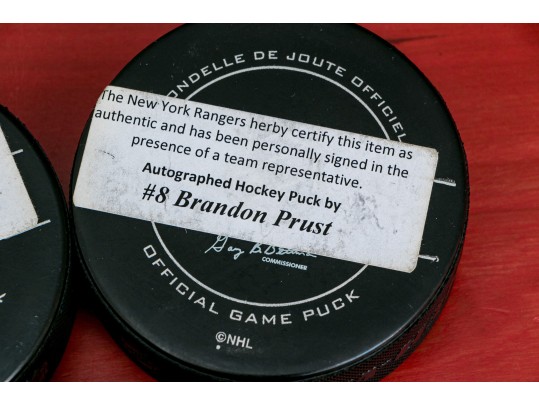 Three Autographed New York Rangers NHL Pucks 