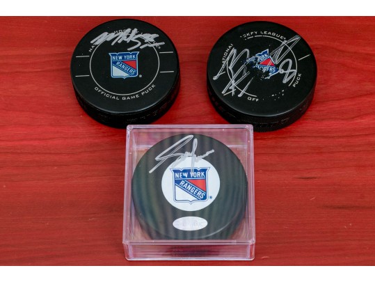 Three Autographed New York Rangers NHL Pucks 