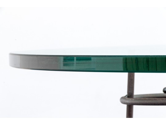 A Beautiful Oval Iron And Thick Glass Cocktail Table