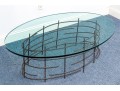 A Beautiful Oval Iron And Thick Glass Cocktail Table
