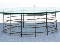 A Beautiful Oval Iron And Thick Glass Cocktail Table