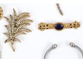 Lot Of Assorted Costume Jewelry Pieces, Including A Trifari Brooch