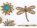 Lot Of Assorted Costume Jewelry Pieces, Including A Trifari Brooch