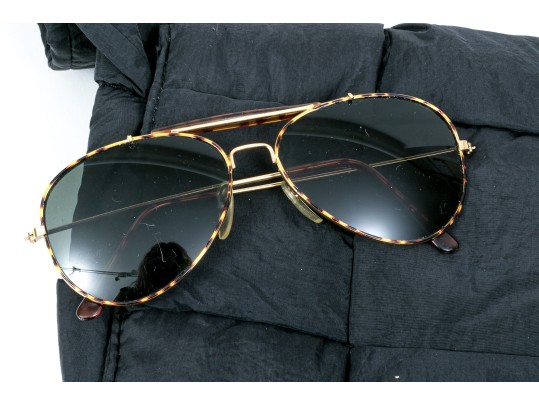 Group Of Assorted Fashion Items, Including Sunglasses, Makeup Bag, And A Quilted Handbag