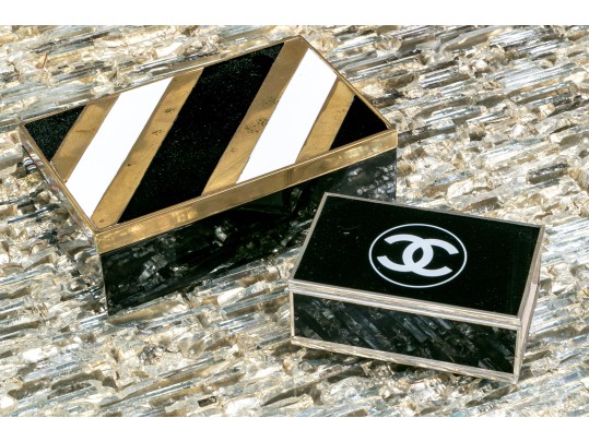 Two Decorative Table Top Items, Including A Striped Lidded Box, And Matchstrike 