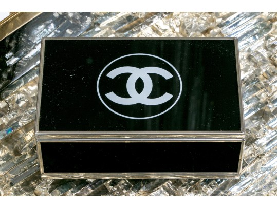 Two Decorative Table Top Items, Including A Striped Lidded Box, And Matchstrike 