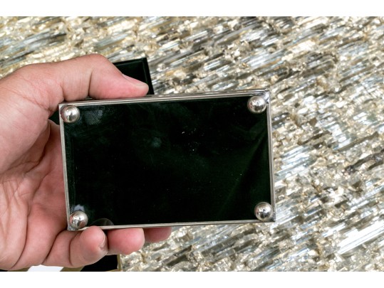 Two Decorative Table Top Items, Including A Striped Lidded Box, And Matchstrike 