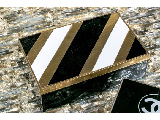 Two Decorative Table Top Items, Including A Striped Lidded Box, And Matchstrike 