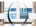 Dramatic Pair Of Jonathan Adler Chrome And Lucite Tusks On Stands