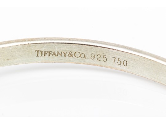 Tiffany & Co. Sterling Silver And 18k Striking Ring Motif Bangle Bracelet