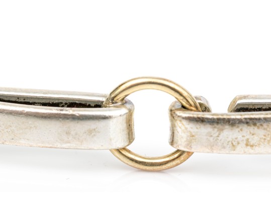 Tiffany & Co. Sterling Silver And 18k Striking Ring Motif Bangle Bracelet