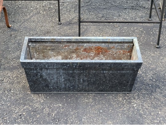 Assorted Collection Of Minimalistic Tables And Planters