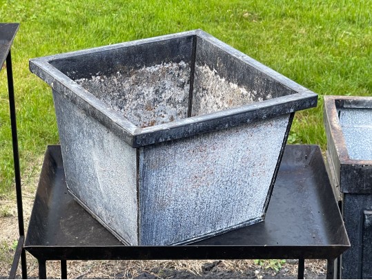 Assorted Collection Of Minimalistic Tables And Planters