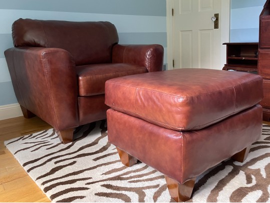 Luxurious Leather Upholstered Club Chair With Ottoman