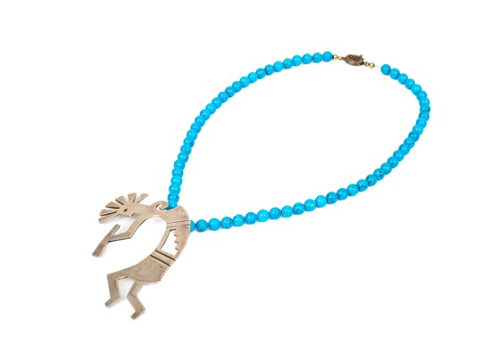 Sterling Silver Impactful Large Kokopeli Pendant, Displayed On A Blue Glass Bead Necklace