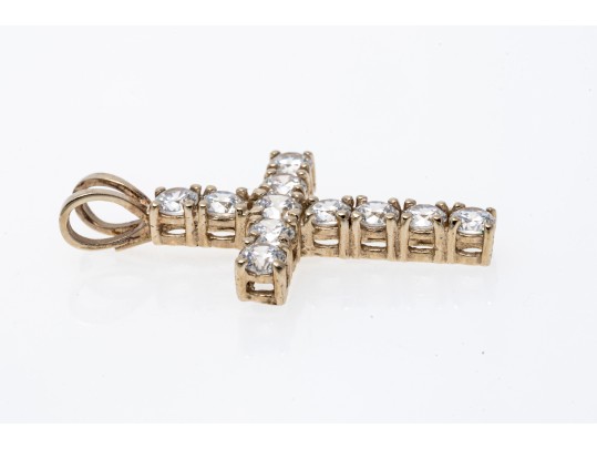 A 14K Yellow Gold Crucifix Pendant Set With CZ Stones