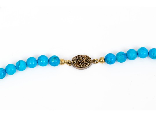 Sterling Silver Impactful Large Kokopeli Pendant, Displayed On A Blue Glass Bead Necklace