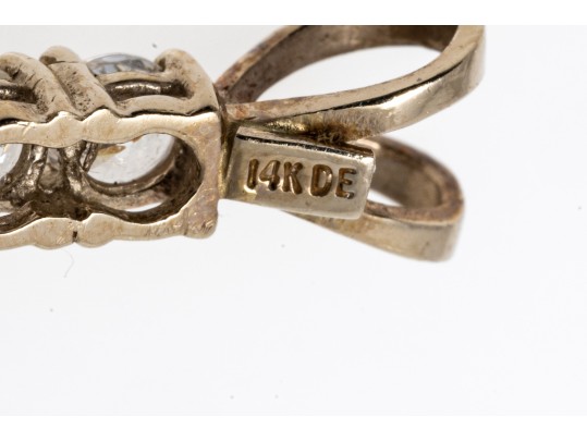 A 14K Yellow Gold Crucifix Pendant Set With CZ Stones