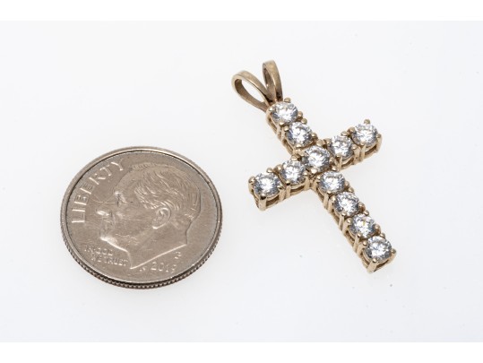 A 14K Yellow Gold Crucifix Pendant Set With CZ Stones