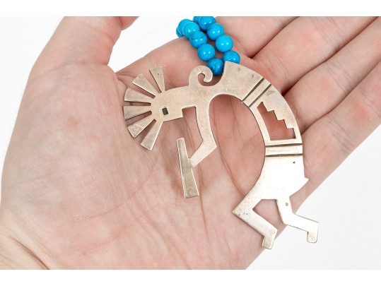 Sterling Silver Impactful Large Kokopeli Pendant, Displayed On A Blue Glass Bead Necklace