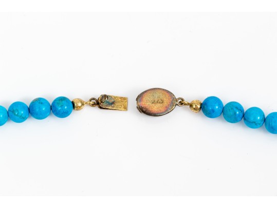 Sterling Silver Impactful Large Kokopeli Pendant, Displayed On A Blue Glass Bead Necklace