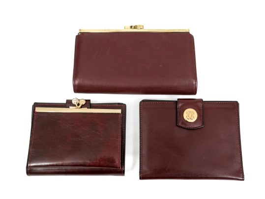 Collection Of Three Burgundy Wallets, Including Etienne Aigner