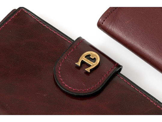 Collection Of Three Burgundy Wallets, Including Etienne Aigner