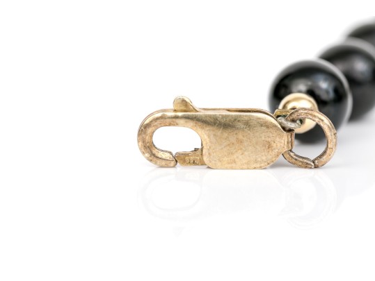 Collection Of Assorted Gold Filled Jewelry Pieces, Including Bracelets And A Stick Pin