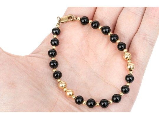 Collection Of Assorted Gold Filled Jewelry Pieces, Including Bracelets And A Stick Pin