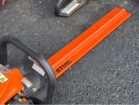 Stihl Chainsaws And Polesaw With A RedMax Weedeater
