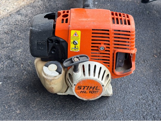 Stihl Chainsaws And Polesaw With A RedMax Weedeater