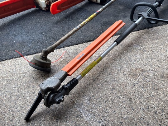 Stihl Chainsaws And Polesaw With A RedMax Weedeater