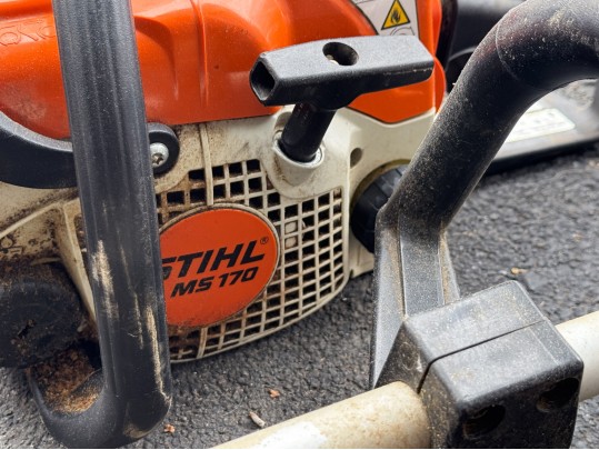 Stihl Chainsaws And Polesaw With A RedMax Weedeater