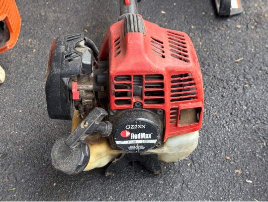 Stihl Chainsaws And Polesaw With A RedMax Weedeater