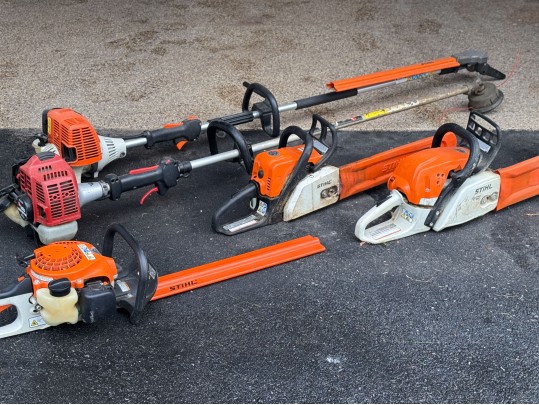 Stihl Chainsaws And Polesaw With A RedMax Weedeater