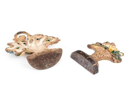 Two Antique Cast Iron Floral Basket Form Doorstops