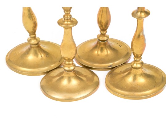 Compatible Set Of Four Antique Brass Candlesticks