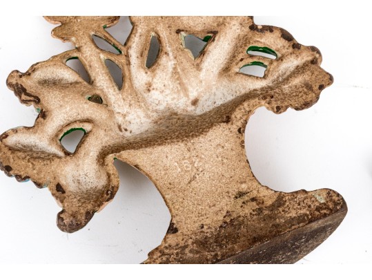 Two Antique Cast Iron Floral Basket Form Doorstops