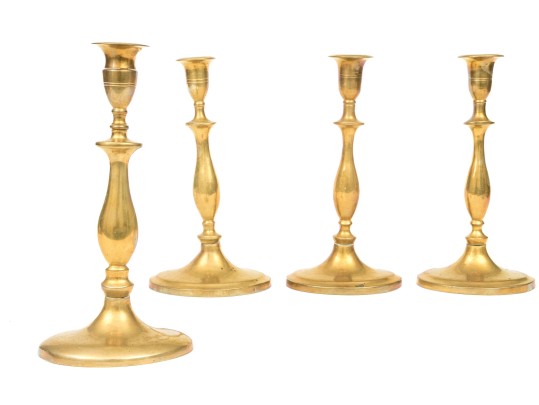 Compatible Set Of Four Antique Brass Candlesticks