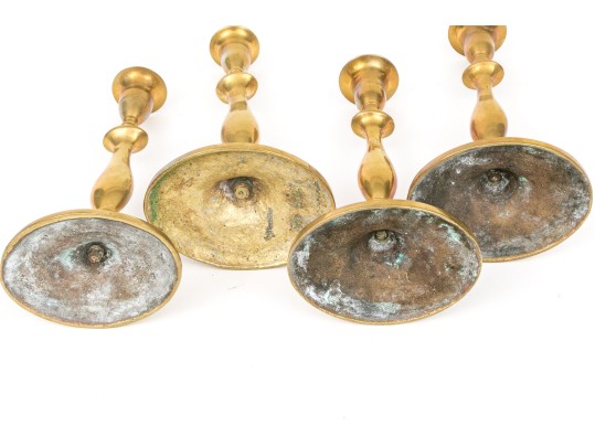 Compatible Set Of Four Antique Brass Candlesticks
