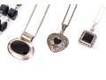Collection Of Sterling Silver And Onyx Motif Jewelry Pieces