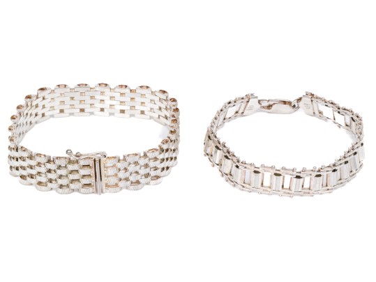 Sterling Silver Woven Bracelet Paired With A Sterling Silver Link Style Bracelet
