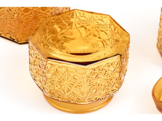 Collection Of Four Amber Glass Vessels With Three Lids