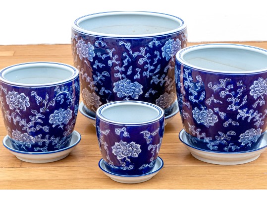 Group Of Four Blue And White Ceramic Jardinieres With Undertrays