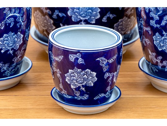 Group Of Four Blue And White Ceramic Jardinieres With Undertrays