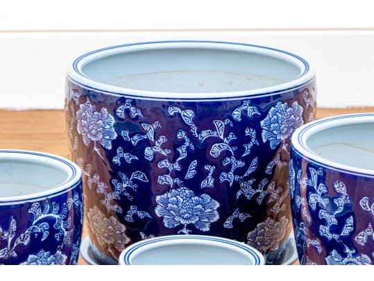 Group Of Four Blue And White Ceramic Jardinieres With Undertrays
