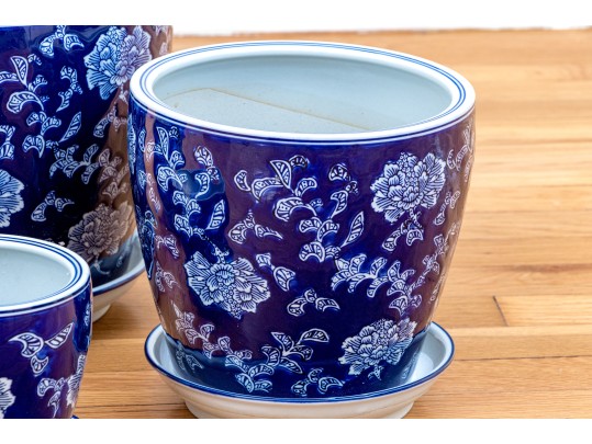 Group Of Four Blue And White Ceramic Jardinieres With Undertrays