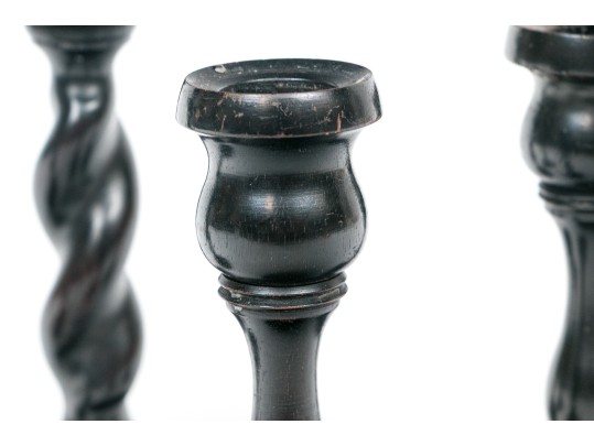 Grouping Of Four Carved Ebony Candlesticks, Including Two Pairs