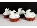 Set Of Four Porcelain Rabbit Covered Dishes With Wicker Holders