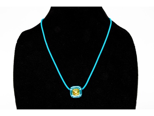 Swarovski Crystal Contemporary Blue Metallic And Cord Necklace With Yellow Crystal Center